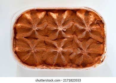 Dessert With Cocoa, Tiramisu Flavored Ice Cream Close Up In A Plastic Box On A White Background, View From Above