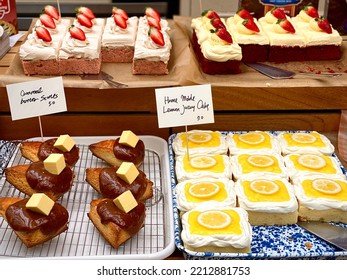 Dessert Display With Caramel Butter Scones, Home Made Lemon Juicy Cake And Strawberry Cream Cake