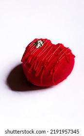 Dessert In The Form Of A Red Heart With Caramel And Gold Leaf On A White Background