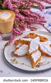 Dessert of French tradition with candied orange and protein in serving with coffee.