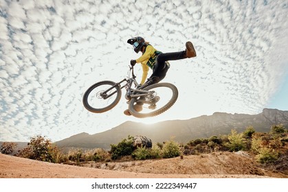 Dessert, mountain bike and high jump trick for crazy fun competitive race, extreme sports performance and stunt freedom. Dirt biker flying in the air, adrenaline sport risk and awesome adventure ride - Shutterstock ID 2222349447
