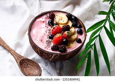 Dessert Nice Cream With Acai Berry In Coconut Bowl. Breakfast In Bed