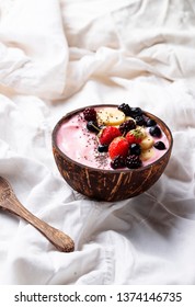 Dessert Nice Cream With Acai Berry In Coconut Bowl. Breakfast In Bed