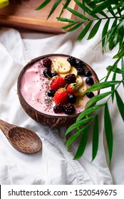 Dessert Nice Cream With Acai Berry In Coconut Bowl. Breakfast In Bed