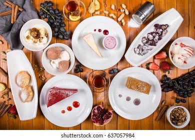 A Lot Of Dessert On The Wooden Table. Georgian Cuisine. Top View. Flat Lay . Khinkali And Georgian Dishes