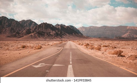 Dessert Road With Mountains In The Background