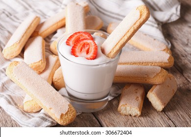 Dessert of Savoiardi with yogurt and strawberries. horizontal