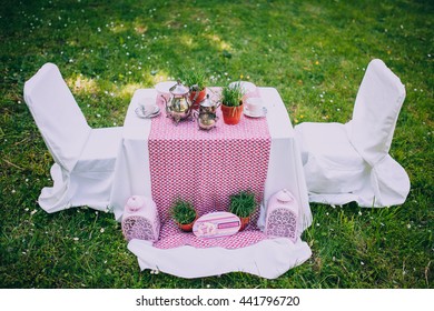 Dessert Table With Cakes Decorated For A Kids Outdoor Party