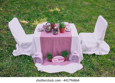 Dessert Table With Tea Decorated For A Kids Outdoor Party