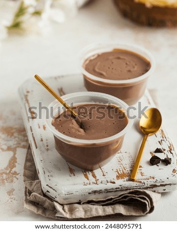 Dessert. Velvety chocolate mousse in containers
