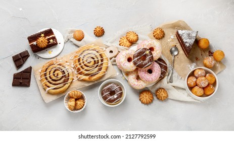 Desserts Assortment On Light Background. Freshly Made Bakery And Treats. Flat Lay, Top View