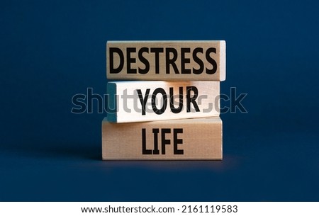 Destress your life symbol. Concept words Destress your life on wooden blocks. Beautiful grey table grey background. Psychological business and destress your life concept. Copy space.