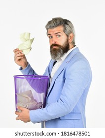 Destroy Evidence. Man Looks For Lost Document In Paper Bin. Recover Document. Insure Important Documents. Recover Files After Deletion. Businessman Holds Trash Can.