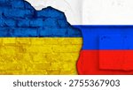 Destroyed brick wall texture in Russian and Ukraine flags colours as background. Confrontation between Ukraine and Russia. Military conflict between Ukraine and Russia concept.