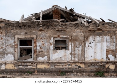 destroyed and burned houses in the city during the war in Ukraine - Shutterstock ID 2279674415