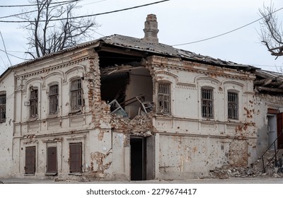 destroyed and burned houses in the city during the war in Ukraine - Shutterstock ID 2279674417