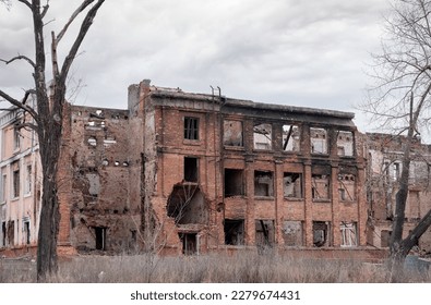 destroyed and burned houses in the city during the war in Ukraine - Shutterstock ID 2279674431