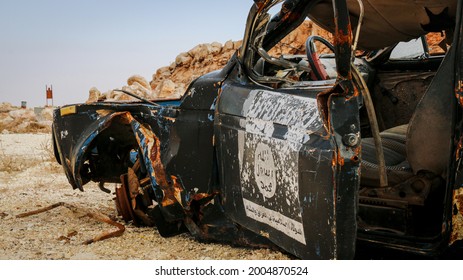 A destroyed car for ISIS . The war on ISIS. ISIS flag.
Aleppo, Syria June 17, 2017