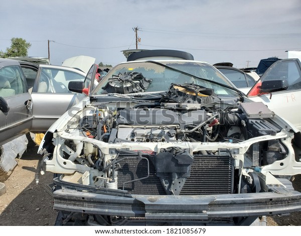 Destroyed car in a junk\
yard