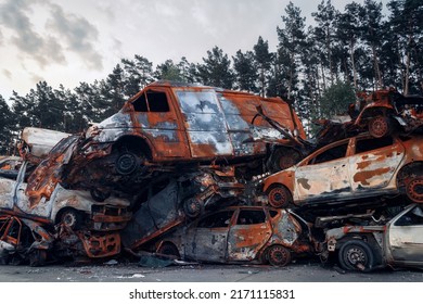 Destroyed and fired on cars in the parking lot. Cemetery of destroyed motor vehicles in Irpin, Kyiv region, 2022.