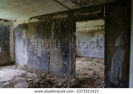 Destroyed panel building of a residential multi-storey and multi-apartment building. Background with selective focus and copy space for text.