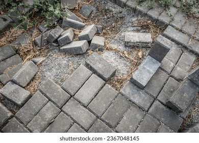 Destroyed pavement from paving slabs in the city - Shutterstock ID 2367048145
