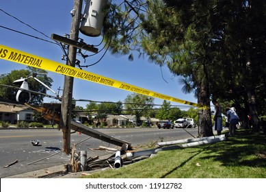 Destroyed power pole after an SUV crashed through it