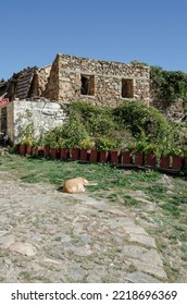 Destroyed And Rebuilding  Old Stone House,on Lake Doxa In Ancient Feneos Of Corinth. Greece