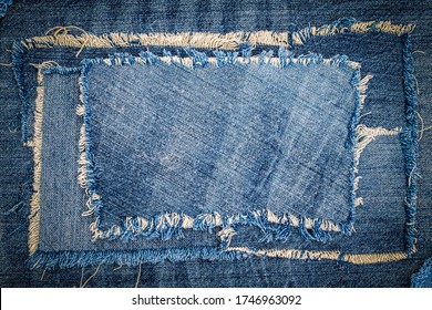 Destroyed torn denim blue jeans fabric patch on blue jeans background. Worn Jeans Casual Double Color patch Denim.
