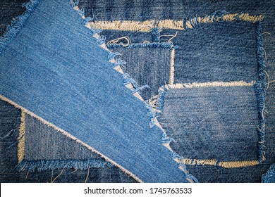 Destroyed Torn Denim Jeans Background. Worn Jean Casual Double Color Patch Denim.