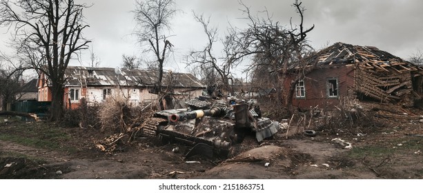 Destroyed Ukrainian tank surrounded by destroyed houses on the outskirts of Chernihiv