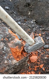 Destruction Of The Brick Foundation Of A Small House With A Sledgehammer 