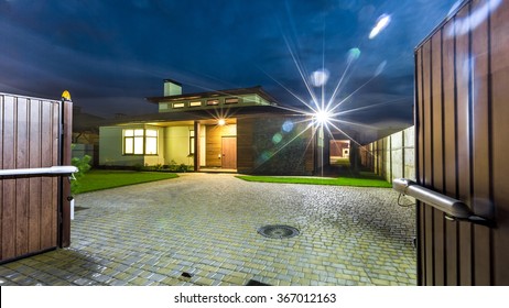 Detached Luxury House At Night - View From Outside. 