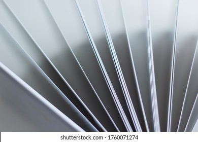 Detail from above of the pages edge of a photo album or an open book with its sheets unfolded