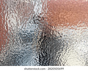 Detail of abstract patterns looking through old style textured glassused in walls of office partitions in an abandoned industrail factory building
