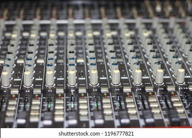 Detail with adjusting knobs on a professional audio mixer and music equipment for sound mixer control, electronic device,selective focus only on some point in image