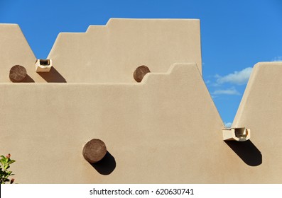 Detail of adobe house with blue sky