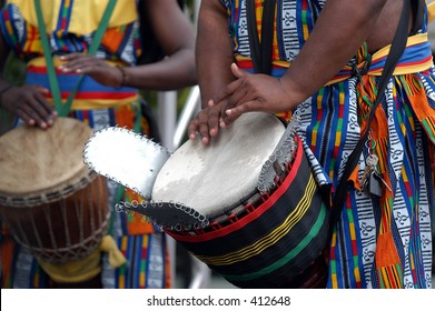 Detail Of African Drummer Beating The Drum