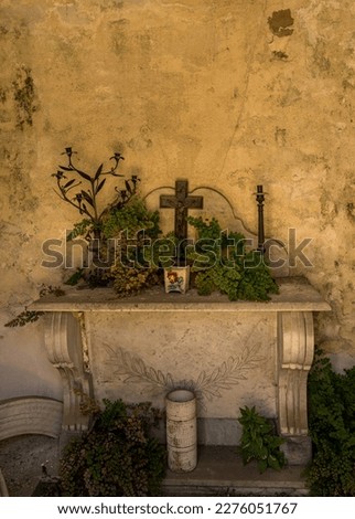 Detail of altar with cross inside burial vault and mausoleum in La Recoleta Cemetery in Buenos Aires Argentina