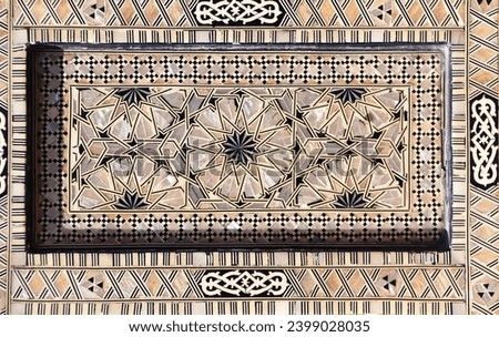 Detail of ancient mosaic window shutter with mother-of-pearl ornaments. Horizontal or vertical background with traditional moroccan tile decoration