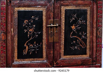 Detail Of An Antique Lacquered Chinese Dresser