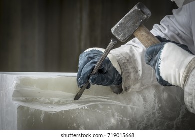 Detail Of Artist's Hands Sculpting Marble With Hammer And Chisel