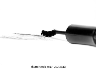 Detail of assortment of makeups reflected on white background. Shallow depth of field