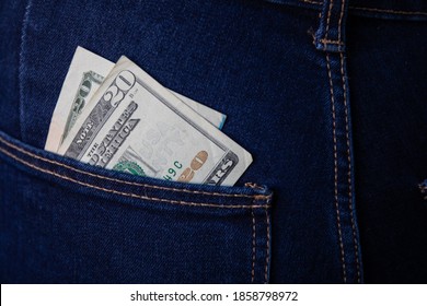 Detail Of A Bank Note In A Back Pocket Of Jeans. The Focus Is On The 20 Dollar Bill.