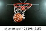 Detail of basketball ball hitting the hoop, top view. Isolated on black background. Freeze motion of sport action.