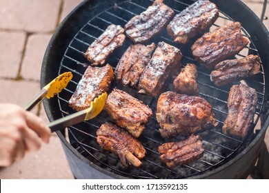 Detail Of BBQ Pork Ribs Grilling On Home Smokehouse