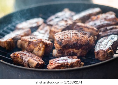 Detail Of BBQ Pork Ribs Grilling On Home Smokehouse