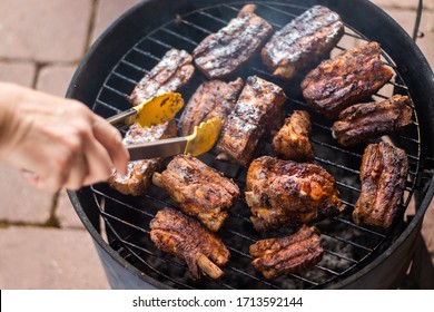 Detail Of BBQ Pork Ribs Grilling On Home Smokehouse