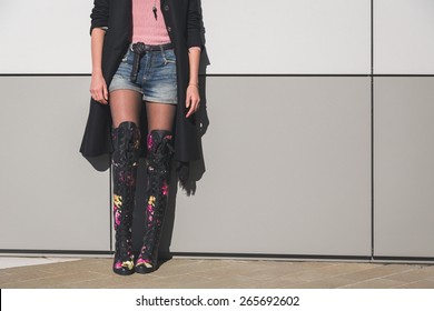 Detail Of A Beautiful Young Woman With Over The Knee Boots Posing In The City Streets