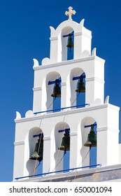 Detail of bell tower of Panagia Platsani in Oia, Santorini, Greece - Shutterstock ID 650001094